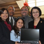 (Courtesy Photo) The John F. Kennedy Elementary School in Hyde Square now has 25 laptop computers for use by students and their families thanks to a donation from Wentworth Institute of Technology. Celebrating the donation at the school on Dec. 16 were (from left): Principal Waleska Landing-Rivera; Joe Boston, director of WIT’s Center for Learning and Community Partnership; student Haley Tejeda; state Rep. Jeffrey Sánchez; and WIT President Zorica Pantic.