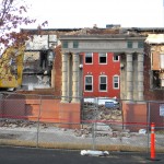 (Photo by Richard Heath) Only the doorway remains standing at 71 Westminster Ave. in Egleston Square, as the fire-damaged building is razed March 8 for forthcoming reconstruction. The Urban Edge-owned apartment building was severely damaged in an Oct. 17 explosion and fire apparently caused by an arsonist. Urban Edge says the reconstruction schedule will be set later.