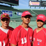 (Photo by Patrick E. O’Connor) English High School baseball players (from left) Jessey Valdez, Nelson Barreiro and Johamin Vicioso pose in Fenway Park, where they joined the South Side team in the Boston City League all-star game on June 10. The North Side team won the game, 11-4.