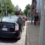 (Gazette Photo by John Ruch) A “parklet” may go where two cars were parked last week on Seaverns Avenue near the Centre Street intersection.