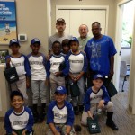 (Courtesy Photo) The Mt. Washington Bank baseball team of the JP Regan Youth League visit the local Centre Street branch on June 30 to celebrate their Farm League championship. Joining them were (back row, from left) coach Jeff Paquette, local branch manager Melvin Tutiven and parent Arthur Atkinson.
