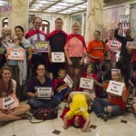 (Courtesy Photo) JP resident Elizabeth Saunders (seated, second from right), the legislative director for Clean Water Action Massachusetts, and JP resident Alex Papali (standing, second from right) were among the “Stroller Brigade for Safe Chemicals” demonstration June 28 at the State House in support of Senate bill 2079, which would require companies to replace toxic chemicals with safer alternatives when feasible.