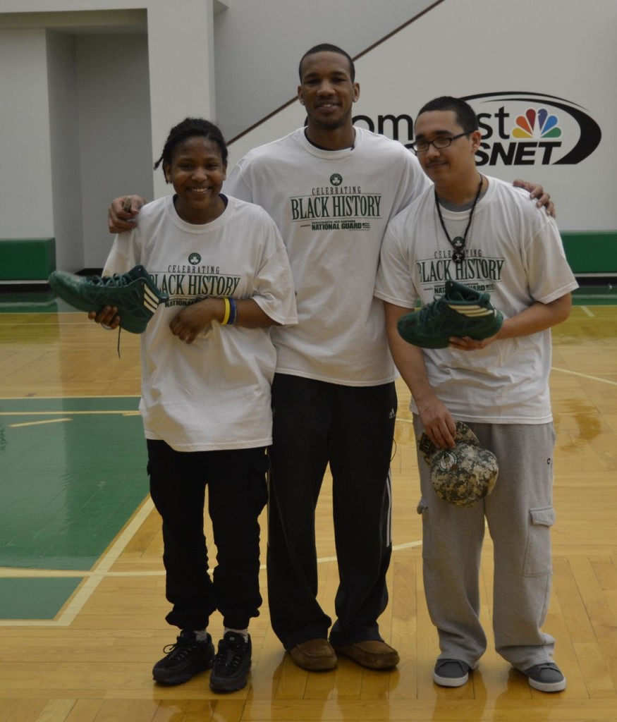 (Courtesy Photo) English High School Army JROTC Cadet Miasia Kemp (left) and Cadet Executive Officer Jorge Maldonado hold shoes signed by Boston Celtics basketball player Avery Bradley (center) during a Black History Month event at the Celtics practice facility in Waltham Feb. 28. Twenty cadets attended the event, hosted by the Celtics and the Massachusetts National Guard, where they talked and shot hoops with Avery and former Celtics players and played a Black History trivia game.