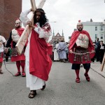 (Photo by Clement Liu) Performers reenacting the Bible story of Jesus Christ forced to carry a cross to the site of his crucifixion walk down Child Street from St. Thomas Aquinas Church on Good Friday, March 29. The event came before the March 31 celebration of Easter, the Christian holiday marking Jesus’s resurrection from the dead.