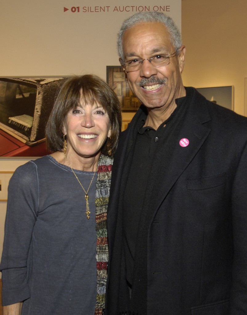 (Photo by Roger Farrington) JP artist Bob Freeman (right) stands with Massachusetts College of Art & Design trustee Susan Schechter at MassArt’s annual benefit auction April 13 at the Huntington Avenue state art school. Freeman donated works for the event, which raised more than $725,000.