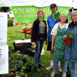 (Courtesy Photo) Roslindale Green & Clean staffers Brooke Nash, Jeff Chasin and Sheryl White and a customer (from left to right) during a previous plant sale.