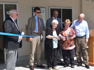 (Courtesy Photo) Mary Carroll, a 125 Amory St. resident, cuts the ribbon on the new PACE Adult Day Health Center at 125A Amory on June 1. Joining her were (from left) Upham’s Corner Health Center CEO Edward Grimes; Dr. Adam Burrows of Upham’s Elder Service Plan; PACE Site Director Jay Trivedi; Upham’s board president Margaret Wirth; and Boston Housing Authority Administrator Bill McGonagle.