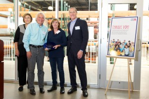 JP residents Sig Street (second from left) and Derryl Irion (second from right) are named Volunteers of the Year at the Greater Boston Food Bank by President and CEO Catherine D’Amato (left) and board chair Woody Bradford (right) earlier this month. Street and Irion also train other volunteers.(Courtesy Photo)
