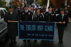 Joining JP’s English High School Army JROTC contingent in the Roslindale Parade Oct. 6 in Roslindale are (from left) Anthony Santiago, Command Sgt. Major Charles Hornbuckle, Carlos Menchaca, Synthia Maldonado, Jahzarie Williams, Lt. Col. David Bennett and Flor Villanueva. (Courtesy Photo)