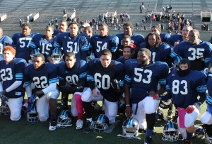 JP’s English High School football team lines up for photos after defeating Boston Latin School in their 127th annual showdown Thanksgiving Day at Harvard Stadium. English beat Boston Latin 14-12, its first win in the rivalry since 1997. (Photo by Patrick E. O’Connor)