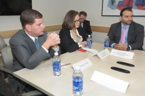 JP resident Felix Arroyo (right), the City’s chief of Health & Human Services, joins Mayor Martin Walsh (left) and Boston Medical Center CEO Kate Walsh (center) in a discussion with members of BMC’s Violence Intervention Advocacy Program, which assists victims of violence in physical and emotional recovery, Jan. 8 at BMC in the South End. (Photo by Isabel Leon/Mayor’s Office)