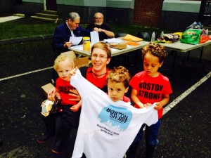 Aaron Becker and his sons join the City’s Boston Shines neighborhood cleanup event May 17 at Curtis Hall. Behind him are local volunteer organizers Michael Reiskind (left) and Bob McDonnell, who organized an annual JP cleanup starting 29 years ago that inspired the citywide Boston Shines event. (Photo Courtesy Mayor’s Office)