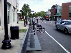 The Hubway bike-share station recently returned to Centre and Green streets in front of the post office. The station debuted in the spot last year, but was was been criticized by some Jamaica Plain residents for taking up post office parking spots and had been moved to Centre Street and Seaverns Avenue earlier this year. “The Boston Bikes program worked with business-owners in the district and found there was stronger support for the Hubway station in its new location in front of the post office on Centre and Green streets,” said Mayor’s Office spokesperson Gabrielle Farrell. (Gazette Photo by Peter Shanley)