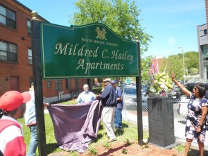 Family, friends, and elected officials gathered on May 18 for the renaming of the Bromley-Heath housing development to the Mildred C. Hailey Apartments. Hailey founded the Bromley-Heath Tenant Management Corporation (TMC) along with Anna Mae Cole more than 40 years ago. It became a nationwide model for tenant-controlled public housing, with Hailey heading it as a major community leader. Hailey died last year. Courtesy Photo